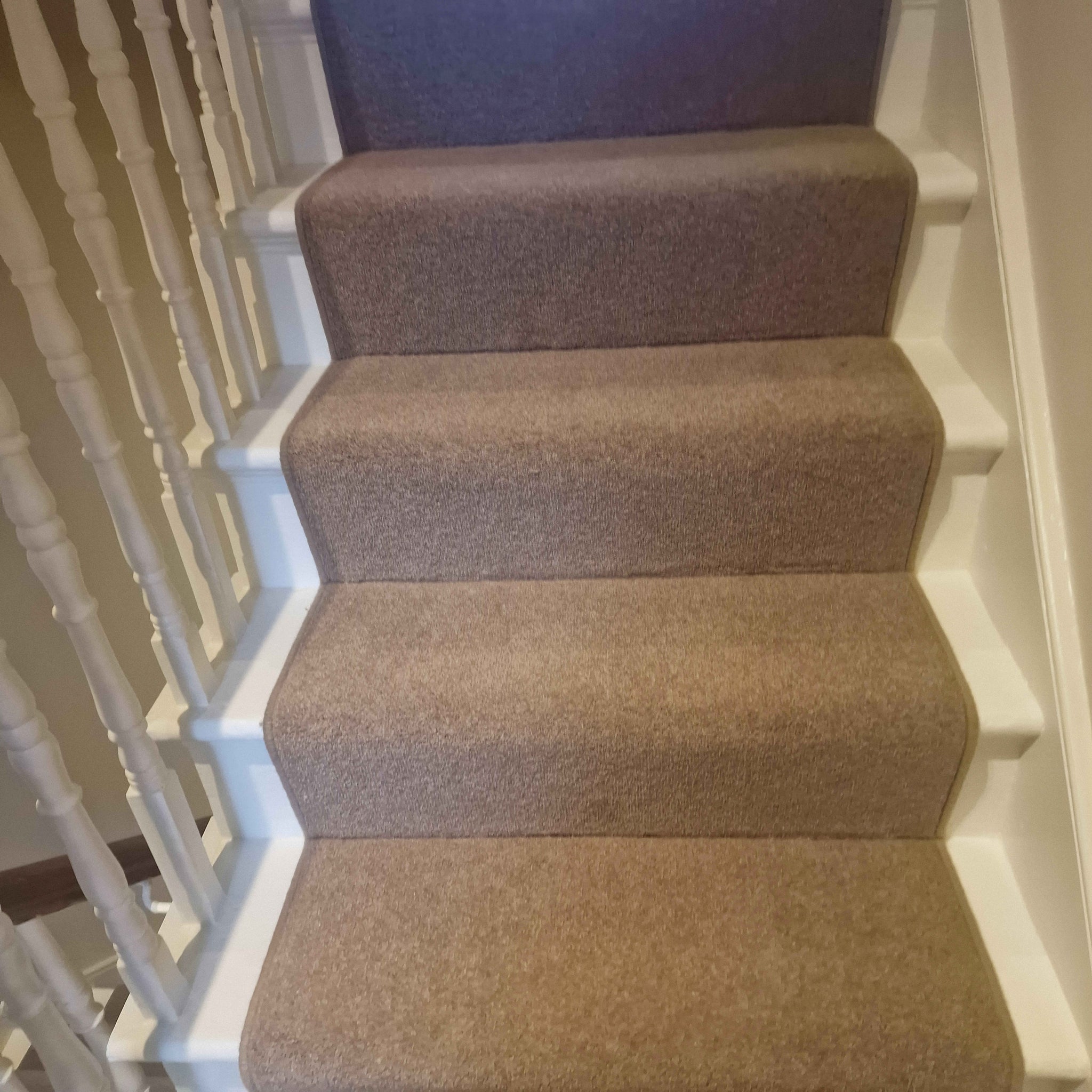 A wool mix carpet stair runner and its a nice dark beige or brown