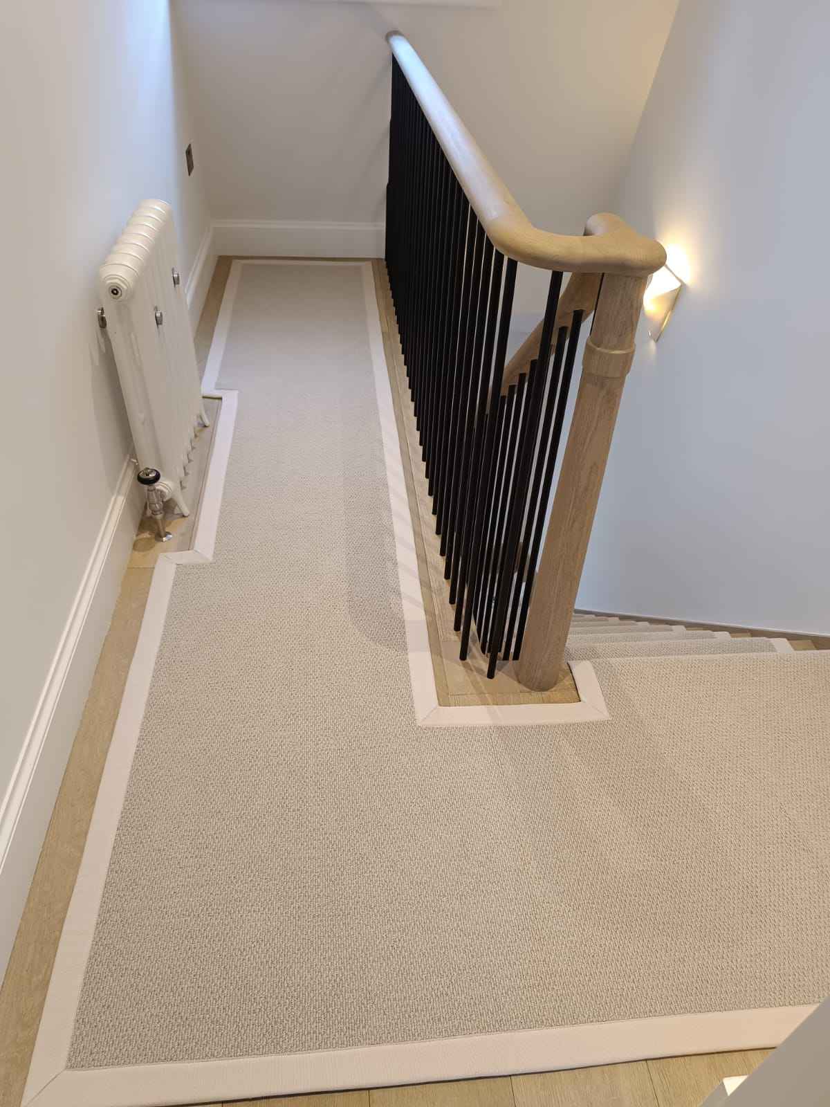 A new wool stair runner with a light beige cotton vorder