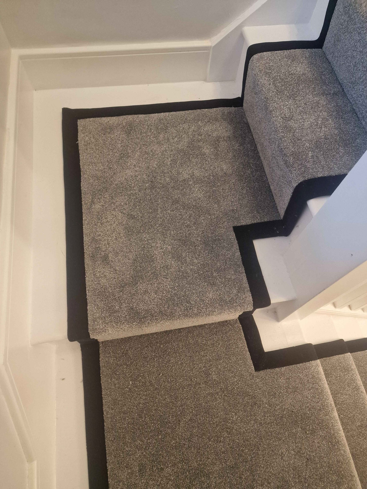 Dark grey Apollo Plus Rainstorm stair runner with black border tape