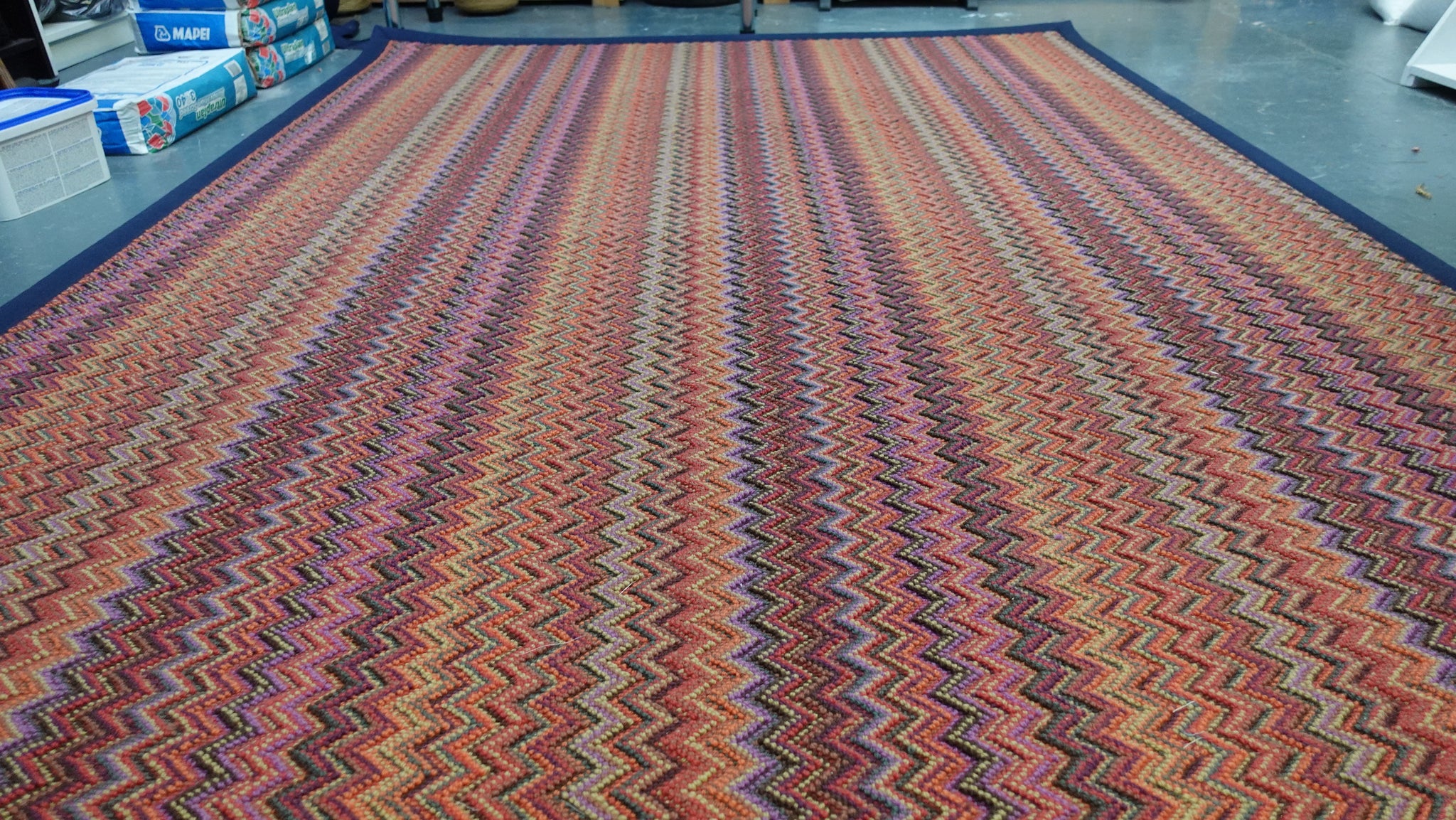Crucial Trading fabulous ruby patterned zigzag rug with a navy blue cotton border 100% New Zealand Wool