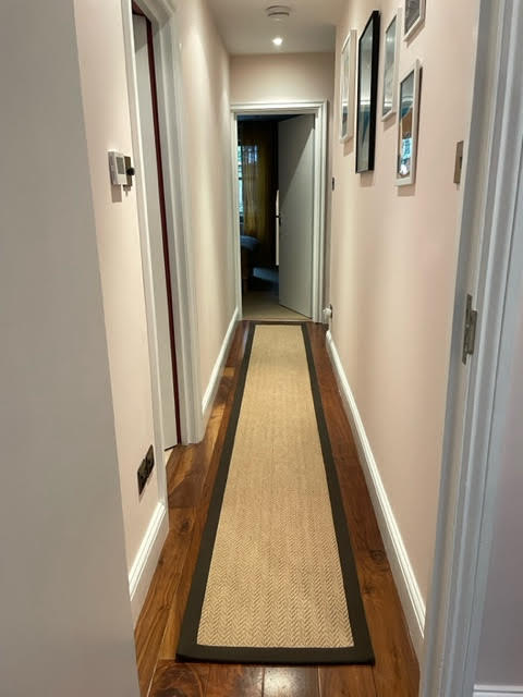 Jute carpet floor runner with brown cotton border